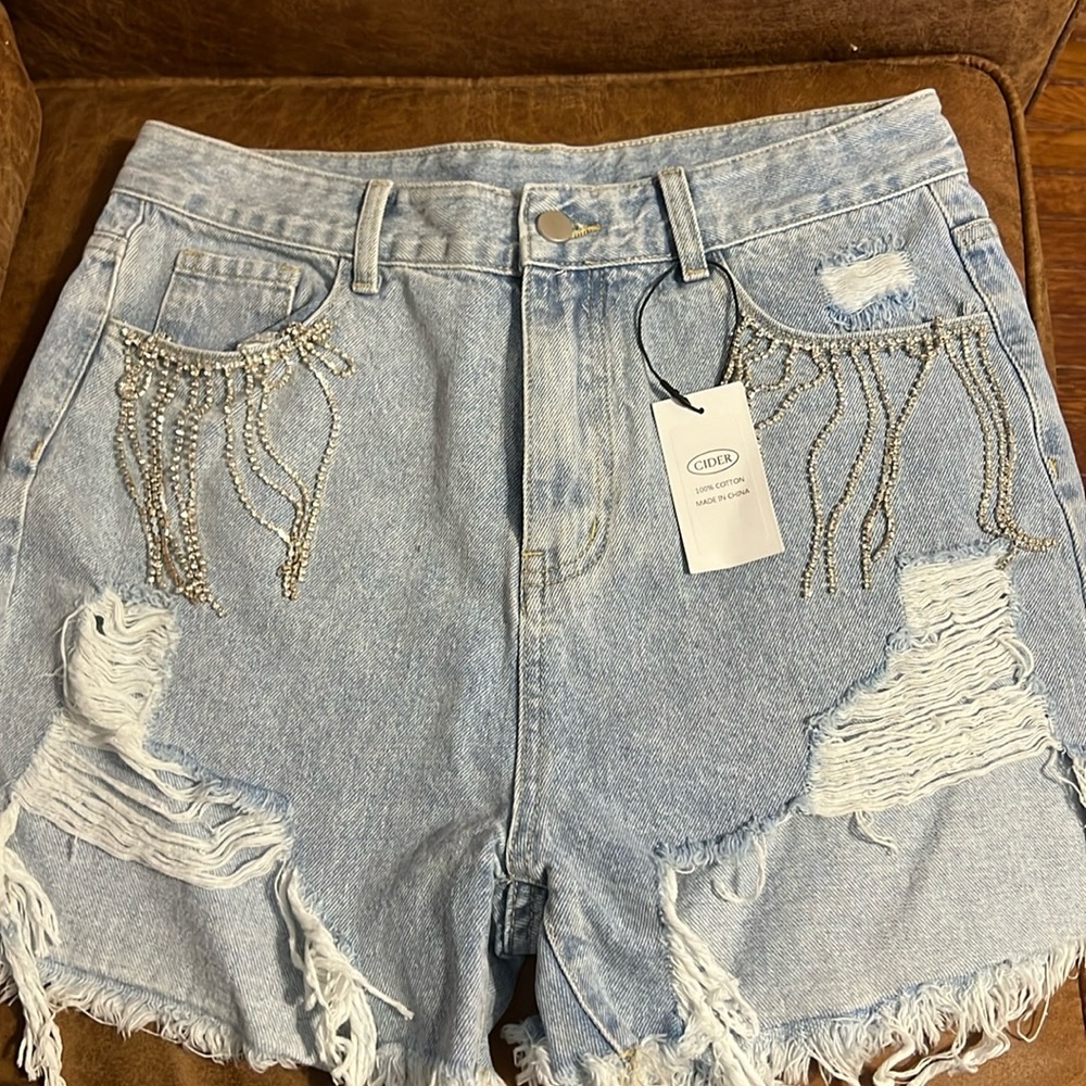 Cider light wash rhinestone fringe shorts. NWT.